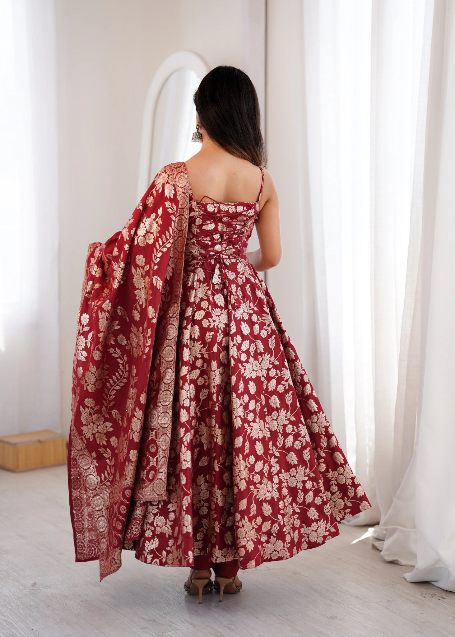 Back view of maroon Anarkali suit with lace-up dori back and dupatta